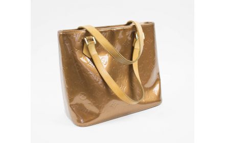 Louis Vuitton Gold Suhali Leather Lockit MM Bag, with gold tone hardware,  the zipper opening to a gold jacquard lining with three in sold at  auction on 11th September