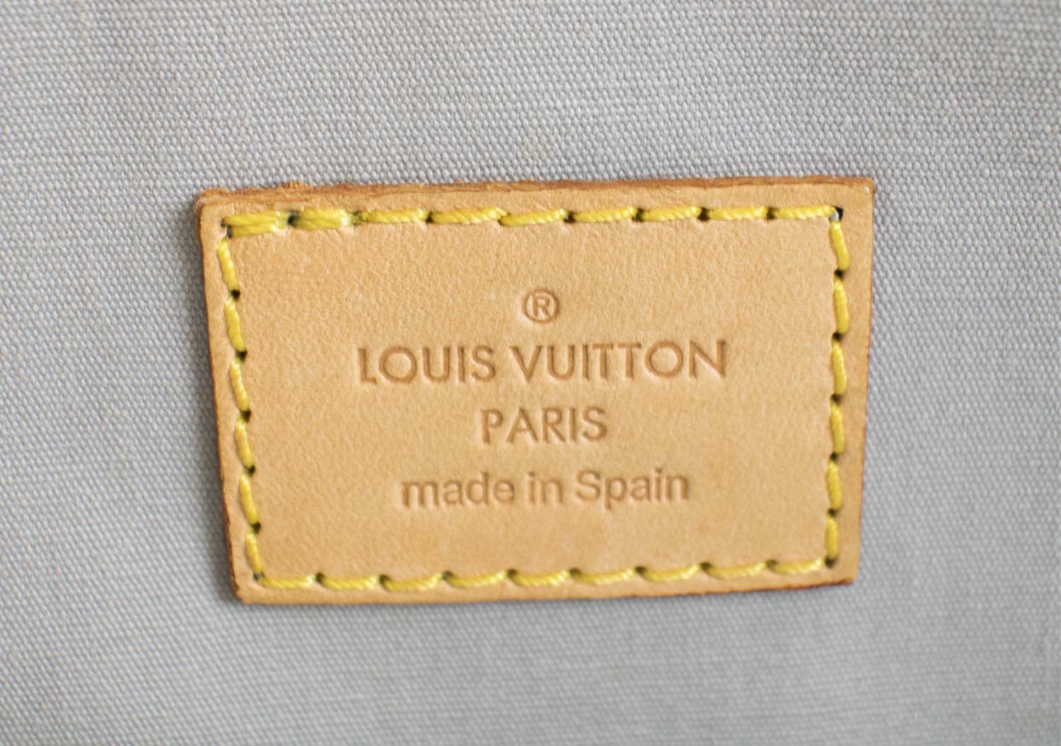 LOUIS VUITTON MONOGRAM VERNIS ROXBURY DRIVE BAG, cream patent leather with  leather trims and detachable shoulder strap, gold tone hardware, snap  closure, light blue/grey fabric lining, 32cm x 17cm H x 11cm.