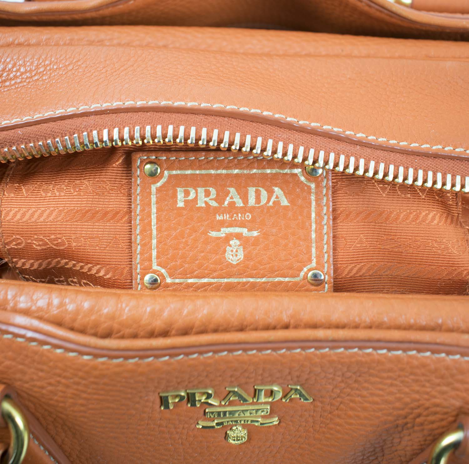 PRADA ORANGE LEATHER BAG, with gold tone hardware, bottom feet, two top ...