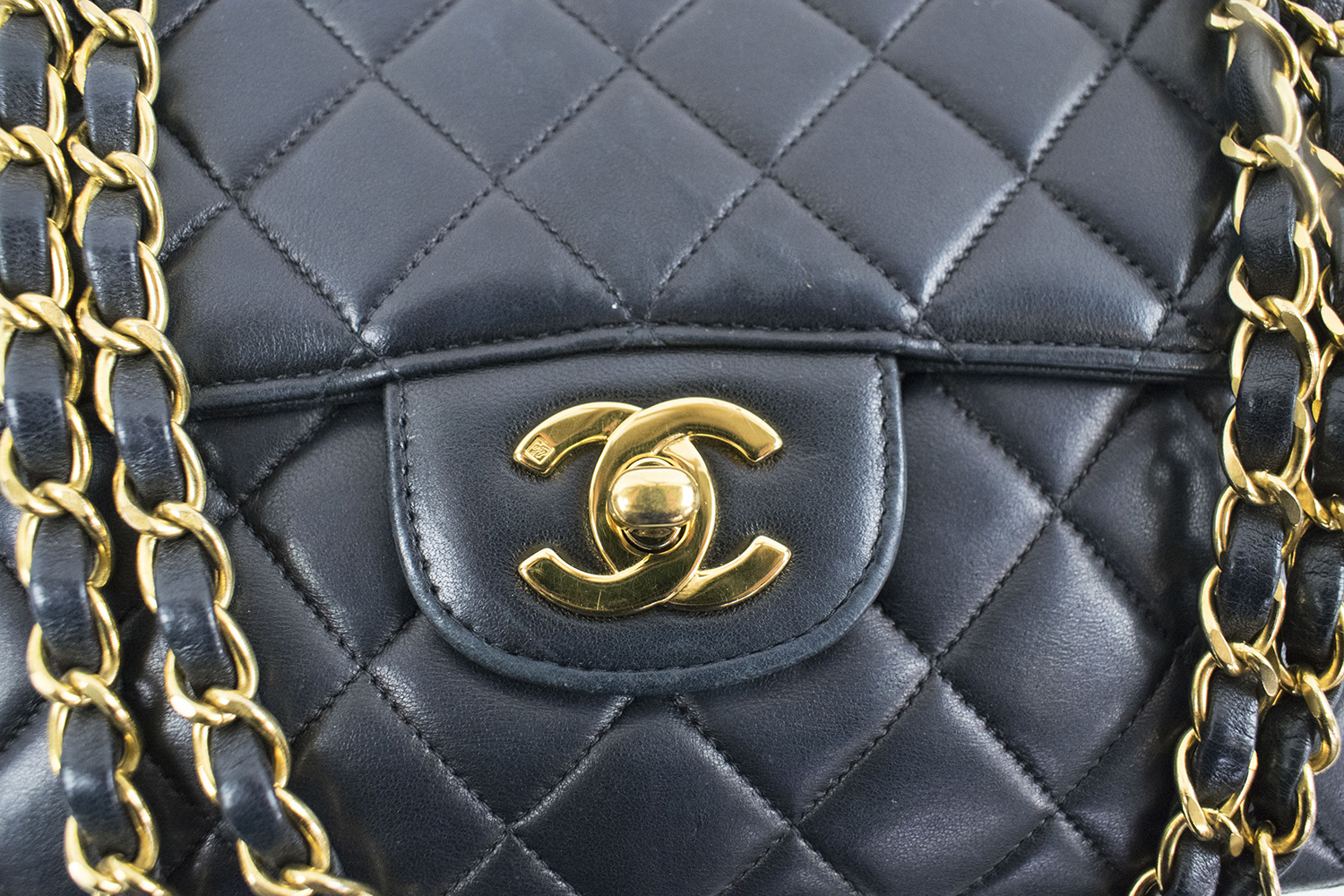 CHANEL DOUBLE SIDED CLASSIC FLAP HANDBAG, black quilted leather with iconic  diamond pattern, gold hardware, chain and leather intervowen shoulder strap,  leather matching interior, inside sticker 4582565, 22cm x 14cm H x