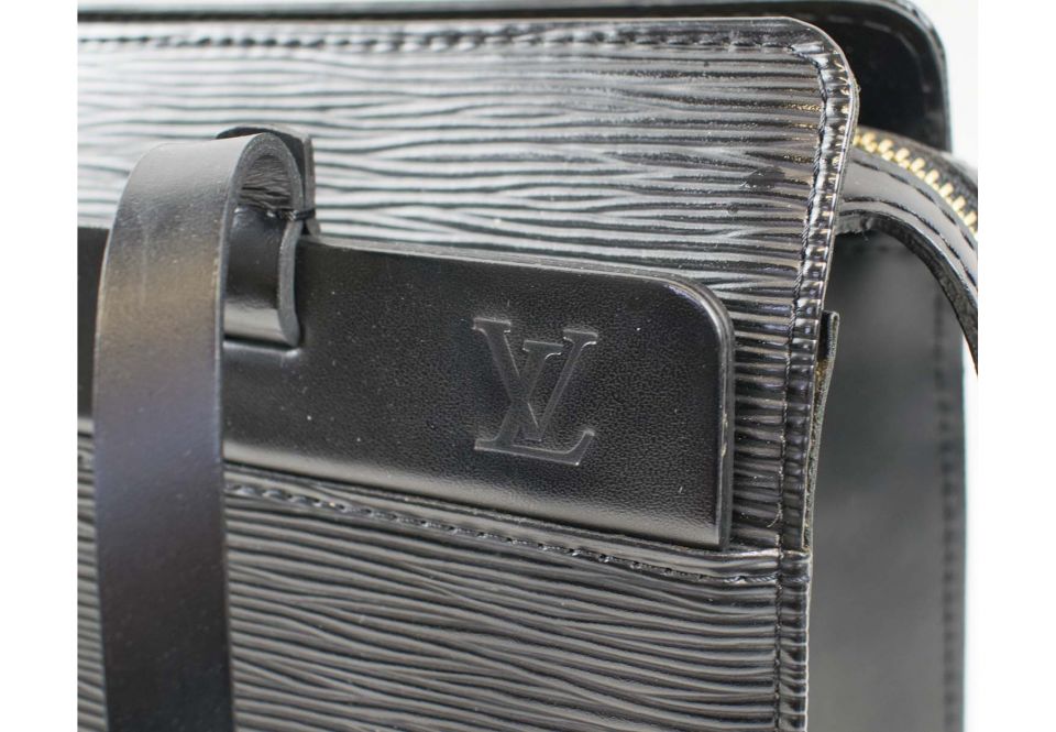 Louis Vuitton, a black epi Croisette PM handbag, designed with a