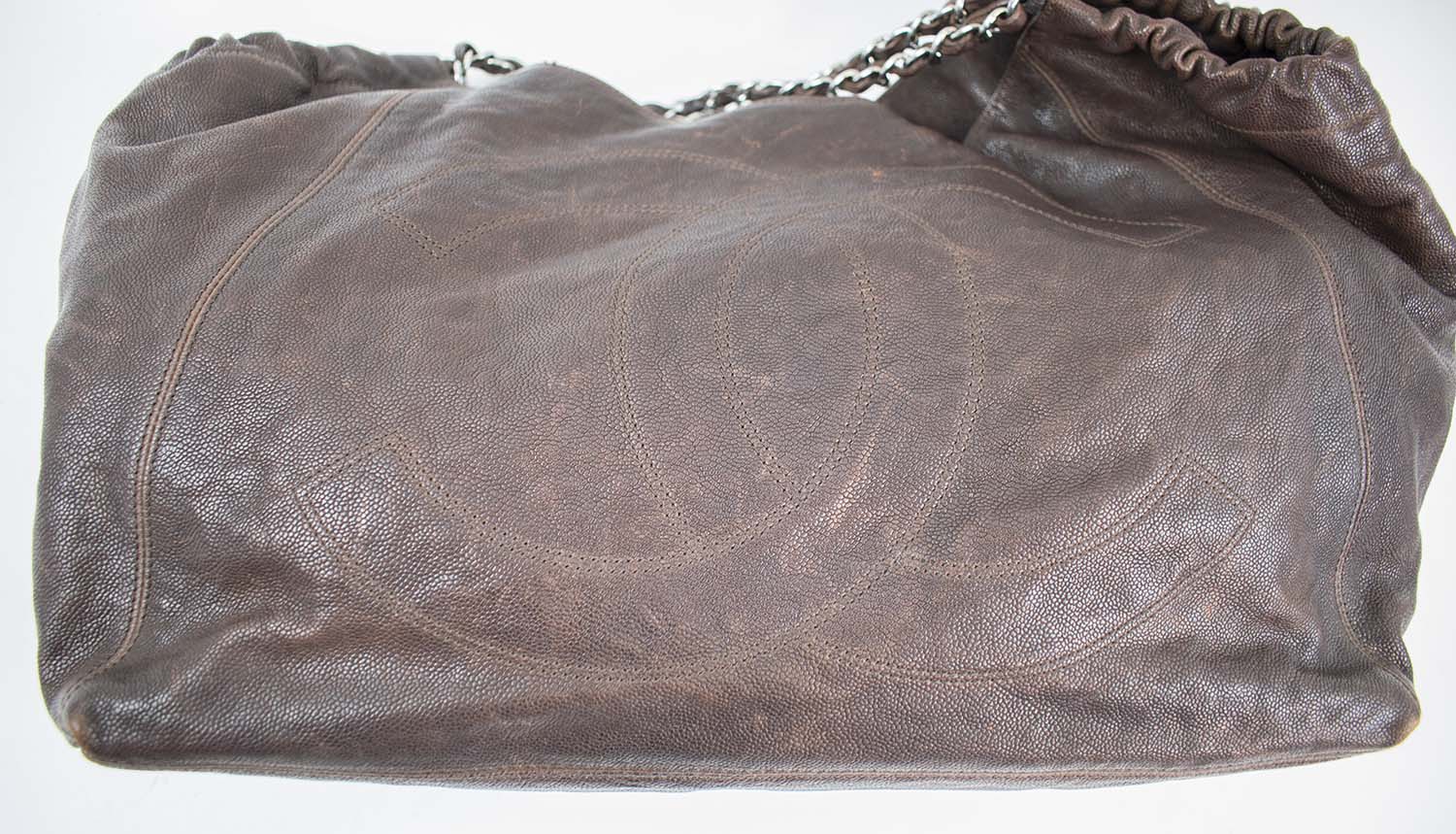 CHANEL COCO CABAS HOBO BAG, brown leather grain with silver tone charm,  leather and chain shoulder strap, logo embossed, fabric lining, inside  sticker 10896371, with inside pouch, magnetic snap closure, 45cm x