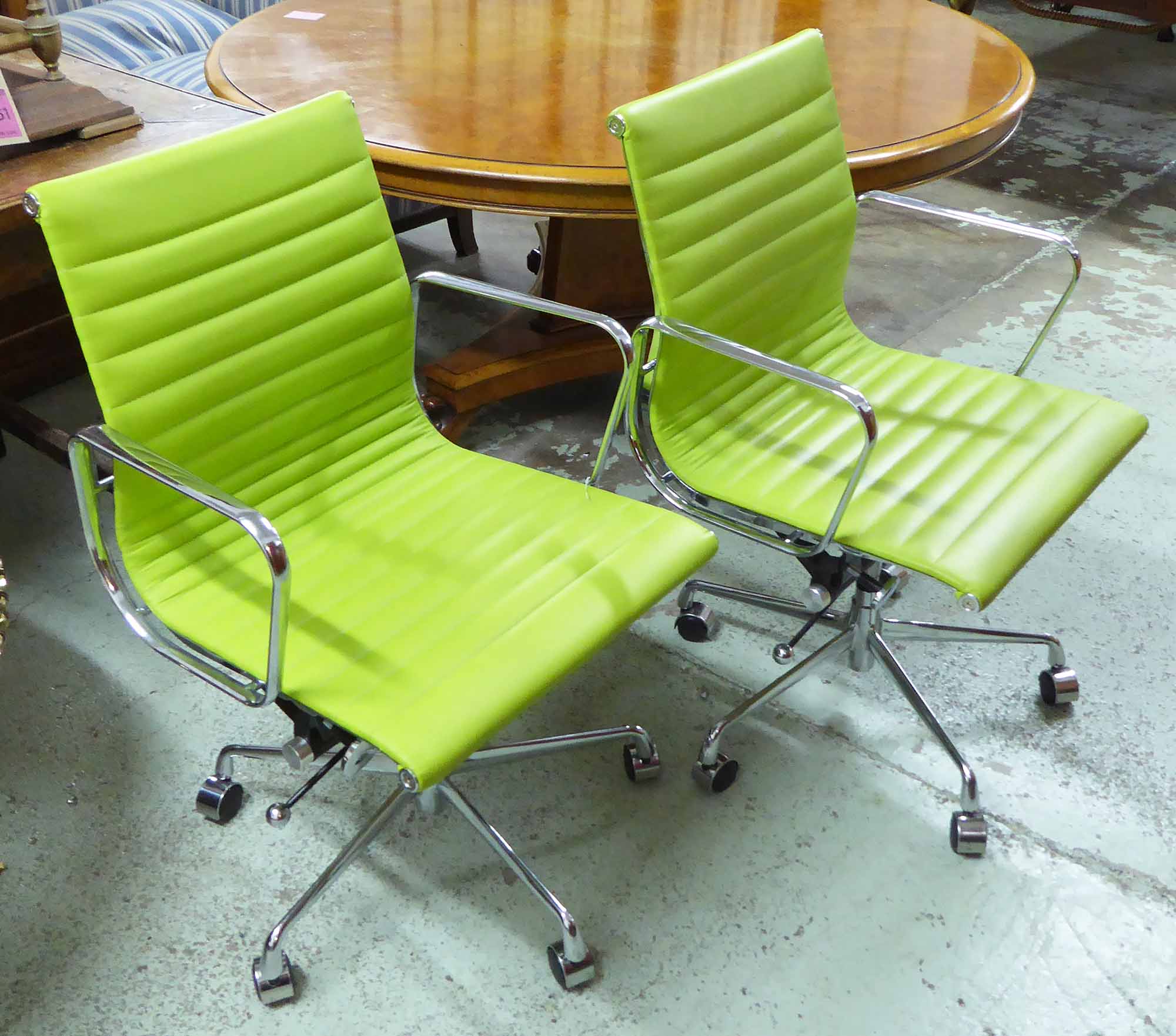 ALUMINIUM GROUP INSPIRED DESK CHAIRS, a pair, after Charles and Ray