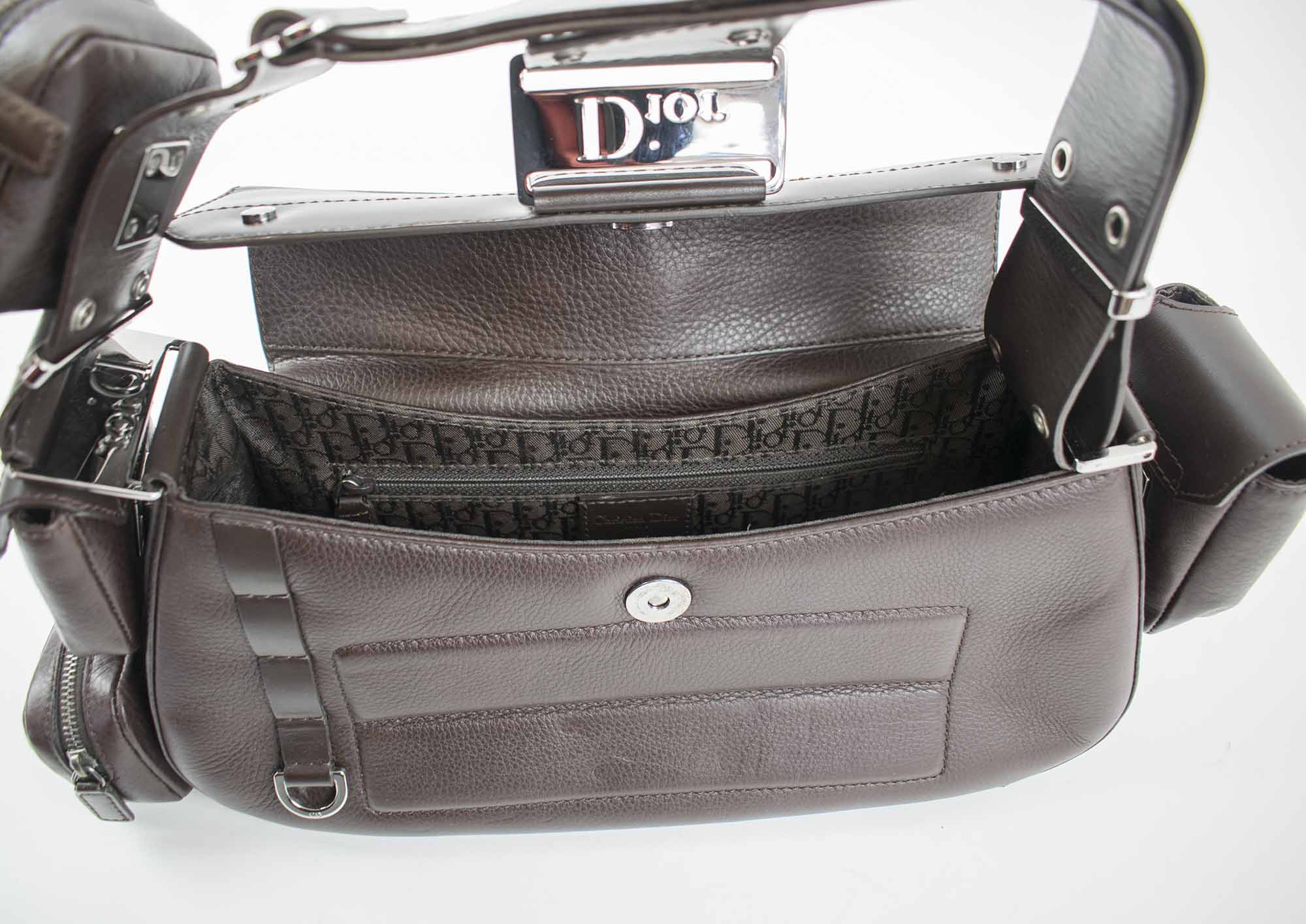 CHRISTIAN DIOR STREET CHIC COLUMBUS BAG, brown leather with brown monogram  fabric lining, multipockets outside, leather shoulder top handle, bottom  feet, frontal flap closure, 30cm (excluding pockets) x 14cm H x 10cm.