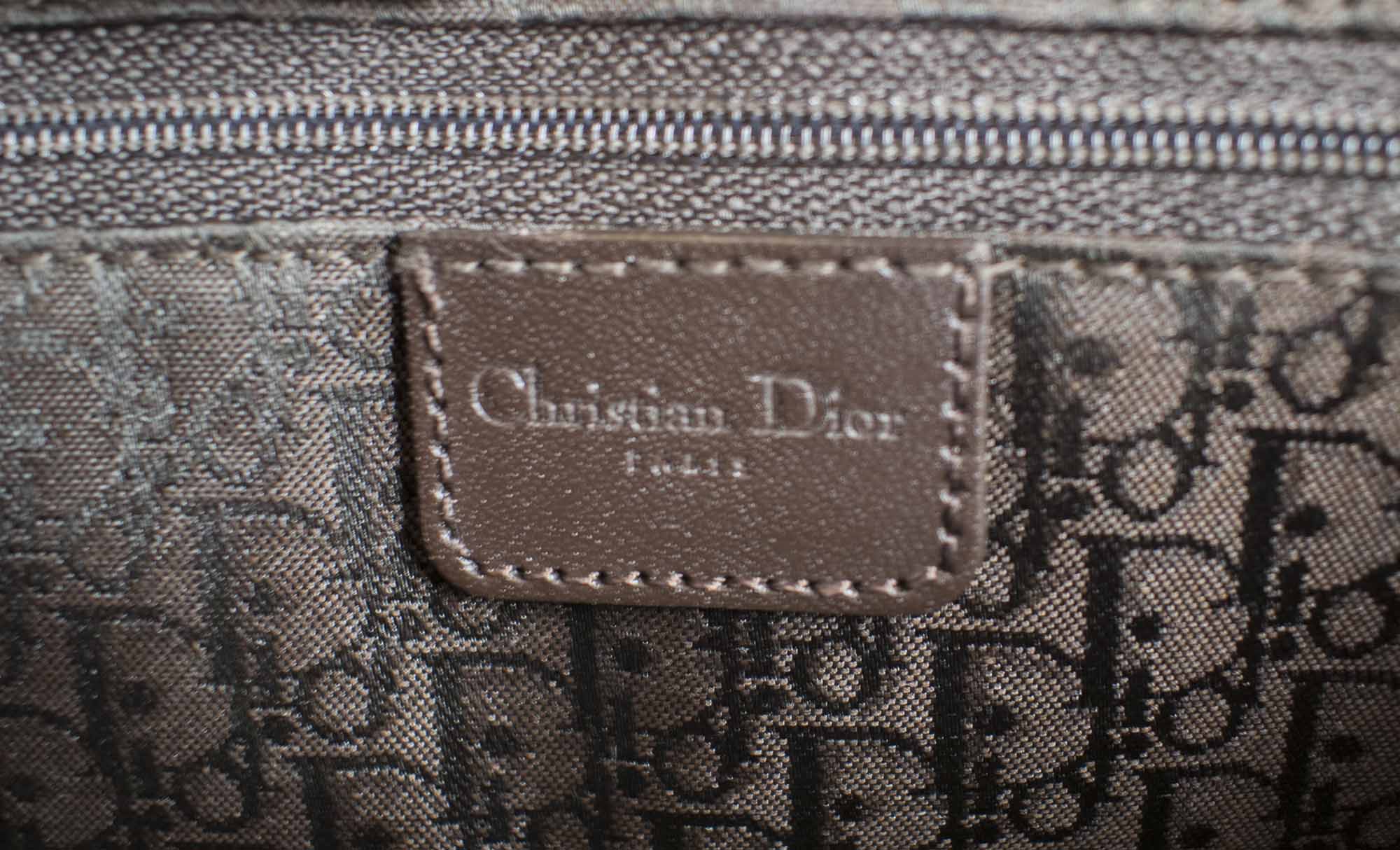CHRISTIAN DIOR STREET CHIC COLUMBUS BAG brown leather with brown monogram  fabric lining multipockets outside leather shoulder top handle bottom  feet frontal flap closure 30cm excluding pockets x 14cm H x 10cm