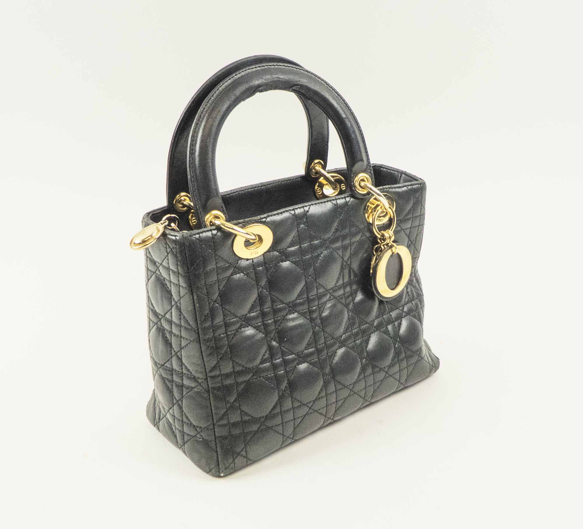 LADY DIOR VINTAGE HANDBAG quilted leather with gold tone hardware and top  zip closure two top handles bottom feet and red fabric lining 25cm x  19cm H x 12cm