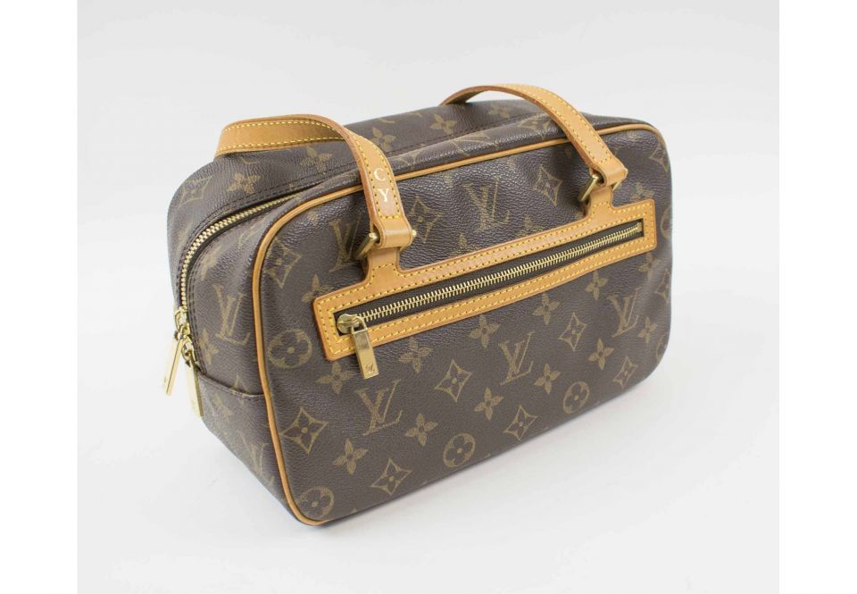 Sold at Auction: Vintage Louis Vuitton monogram tote, having two outer side  pockets, interior zipper pocket, marked Louis Vuitton / Paris / Made In F