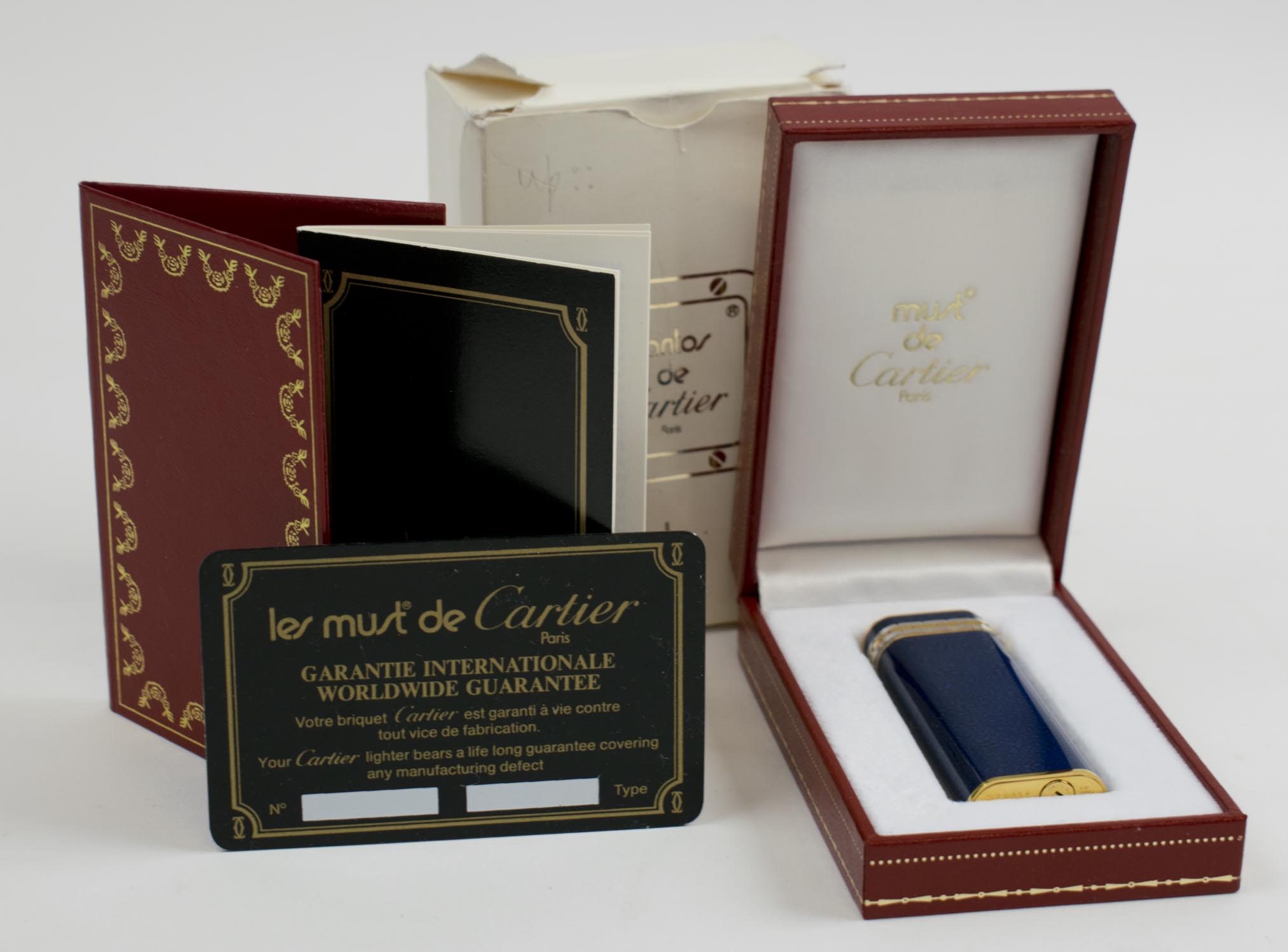 CARTIER LIGHTER, with gold plated blue lacquer case, 7cm plus box and ...