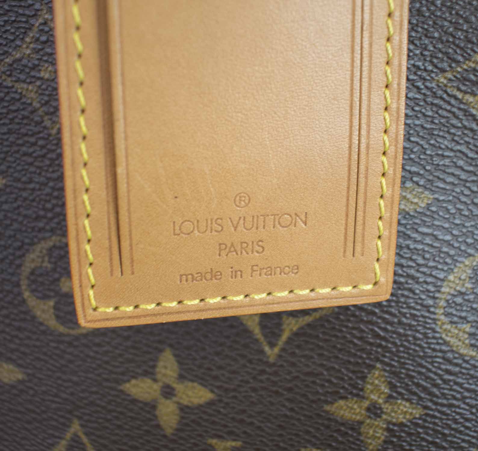 LOUIS VUITTON STEAMER BAG, a collector's piece, monogram canvas with tan  leather base, trims and handle, gold tone hardware, with tag, 45cm x 20cm x  52cm H and a Louis Vuitton Poids