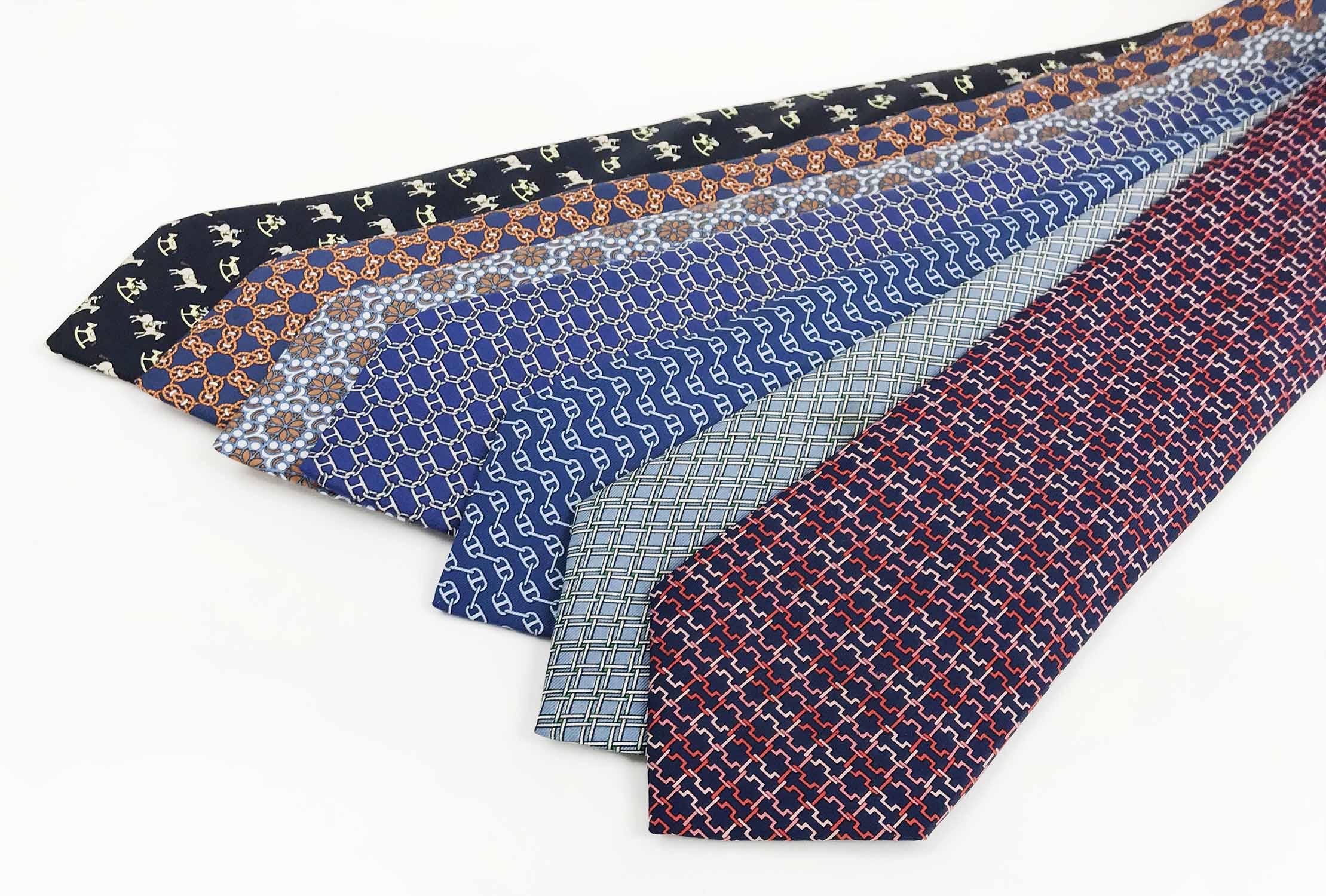 HERMÈS TIES, a collection of seven patterned silk ties. (7)