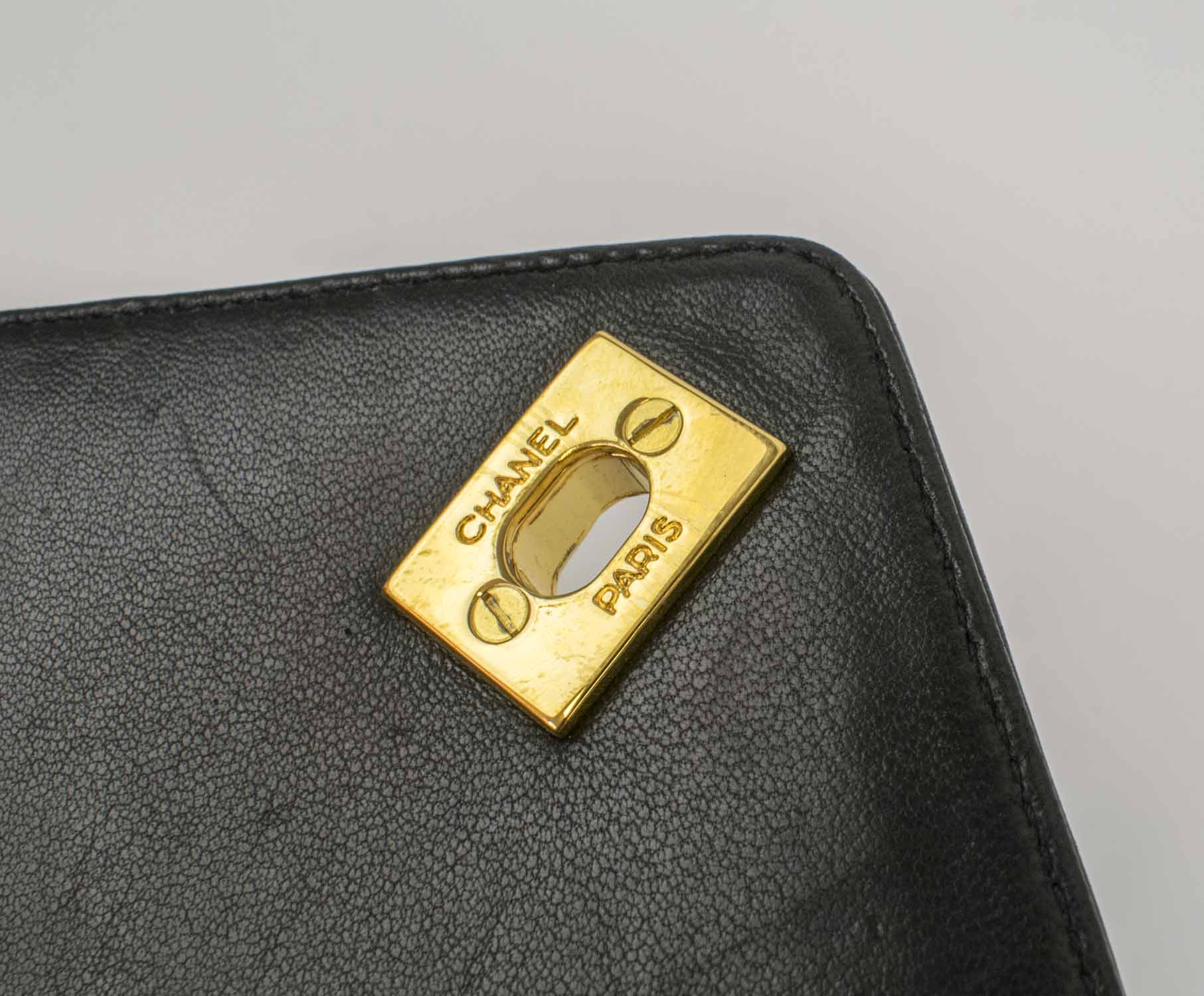 CHANEL CAMERA VINTAGE CHEVRON BAG, with top zip closure with charm pull,  one front pocket with CC turn lock closure, gold tone hardware and strap,  leather lining, authenticity card 2619847, 1991-1994, with