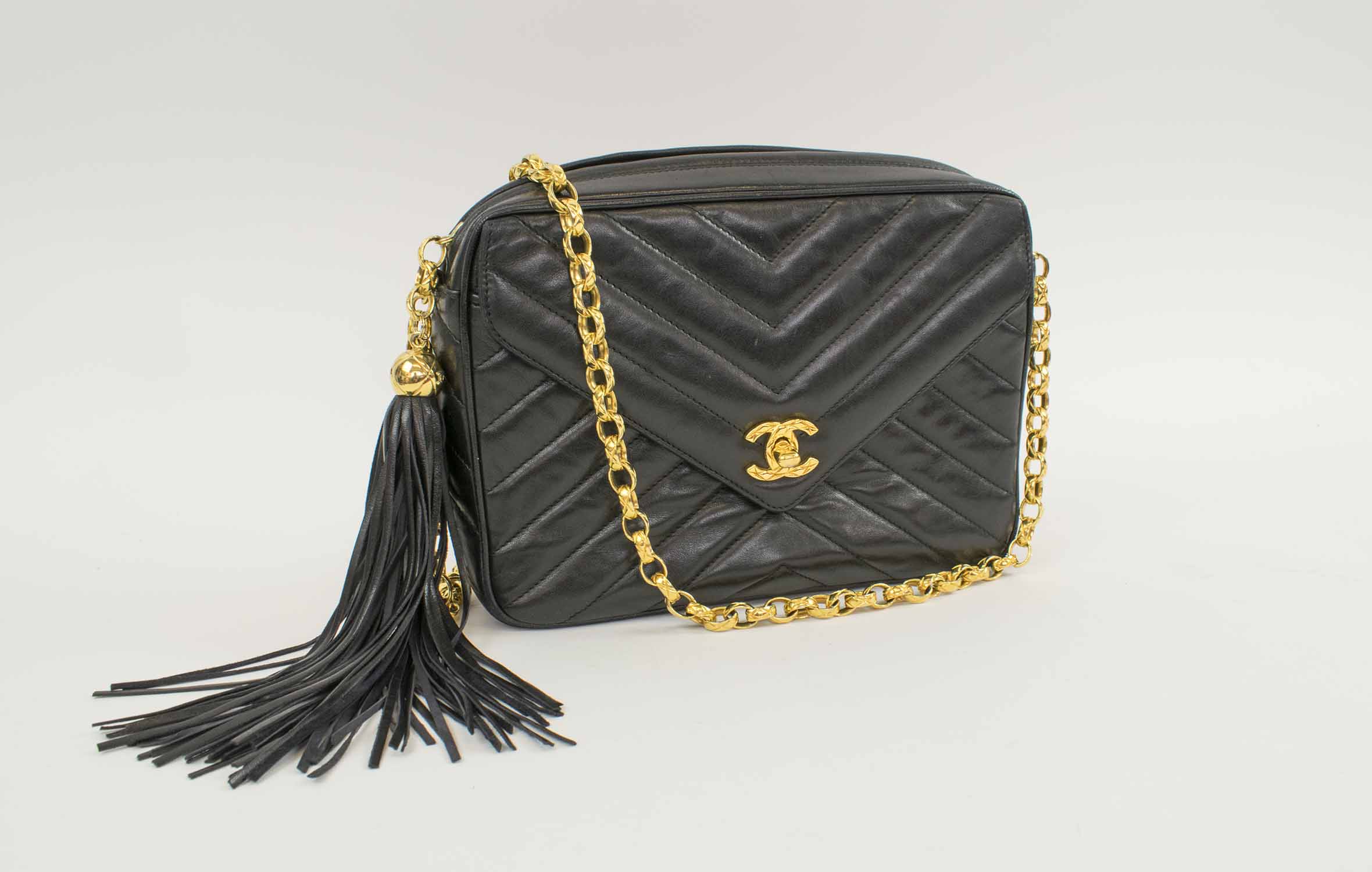 Sold at Auction: Chanel 1990 Chevron “V” Quilt Shoulder Camera Bag in Black  Leather