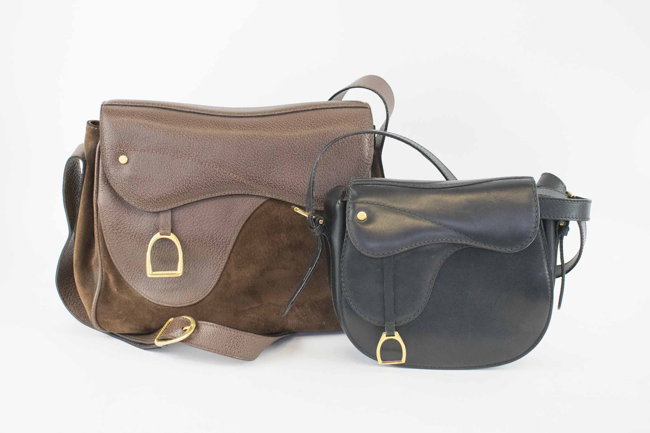 GUCCI VINTAGE SADDLE BAGS, with equestrian stirrup charm, one brown leather  and suede 30cm x 23cm H x 12cm, the other black leather 20cm x 18cm H x 6cm  both with adjustable