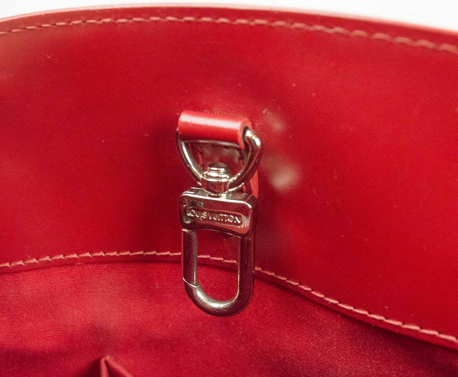 Sold at Auction: A LOUIS VUITTON RED PATENT LEATHER ZIPPER BAG